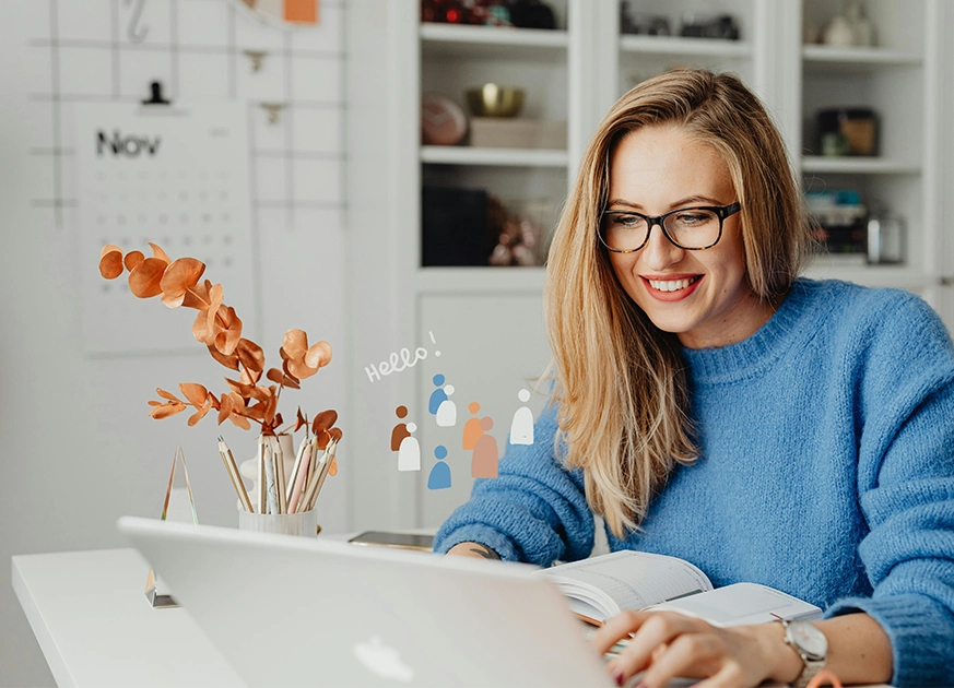 A woman works on a laptop with "Hello!" and people icons, showing connection through digital marketing services